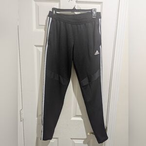 Adidas Black Track Pants with White Side Stripes, Two Front Zippered Pockets.